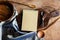 Notebook and wooden utensil in kitchen on old wooden background