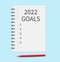 Notebook with the words goals 2022. Notebook paper for text with pencil on blue background. Vector illustration