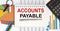 Notebook writing account payable, table with charts and office tools