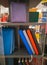 Notebooks and diaries on shelf of art shop. Notepads and diaries of different colors.