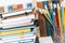 Notebooks piles, stack of books education back to school background, textbooks and pencils in plastic holder with copy space for