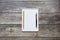 Notepad with a blank white sheet in a checker paper with ball pen and simple graphite pencil lies on the background of wooden