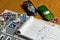 Notepad, book of traffic rules, toy cars, traffic lights and stop sign on a desk table