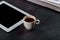 Notepad and espresso coffee cup on office wooden table