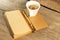 Notepad, Gold Pen, Cup of Coffee on Wooden Table