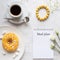 A notepad for meal planning with breakfast setting and ladies accessories