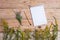 Notepad and medicine herbs on wooden table - alternative medicin