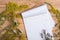 Notepad and medicine herbs on wooden table - alternative medicin