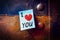 Notepad on a metallic pinboard, Text i love you with a heart