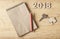 Notepad with number paper 2018 on wood backgorund for happy new