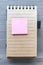 Notepad with a Pink Post-It