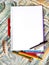 Notepad for the sketch on a colourful background with a pencils