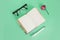 Notepad, stationery pen, glasses and pink rose