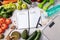 Notepad with words Meal Plan with healthy foods and sport equipment