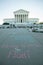 Notes and flowers are left at the Supreme Court of the United States in memory of the late Supreme