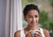 Nothing beats a relaxing warm morning drink. a young woman enjoying a cup of coffee.