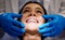 Nothing boosts your confidence like a bright, beautiful smile. a young woman having a dental procedure performed on her.