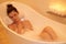 Nothing bothers her in the bathtub. High angle shot of an attractive young woman taking a bubble bath.