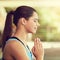 Nothing brings me peace like yoga does. a young woman practising yoga.