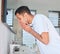 Nothing feels better than having a clean face. a young man washing his face in a bathroom at home.