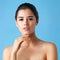 Nothing inspires confidence like healthy skin. Studio portrait of a beautiful young woman posing against a blue