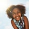 Nothing makes me smile brighter than a summers day. Portrait of a happy girl standing outside on a bright summers day.