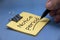 Notice period text on sticky note with hand on blue cover background. Resignation concept