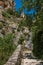 The Notre-Dame de Beauvoir church amidst cliffs and rocky pathway