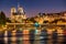 Notre Dame de Paris, Seine River and the Sully Bridge at twilight. France