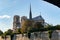 Notre Dame de Paris from under the Pont de l`Archeveche - Paris, France
