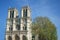 Notre-Dame de Paris West towers Blue sky Tree