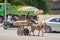 Nouakchott, Mauritania - October 08 2013: Street scene with vehicles and donkey cart