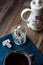 Nougat candy in a glass and tea, blue napkin