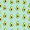 Nourish with Nature: Hand-Drawn Vector Avocado Slices Forming a Seamless Pattern on Blue Background.