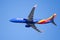 Nov 21, 2019 San Jose / CA / USA - Southwest Airlines aircraft in flight; the Southwest Airlines heart Logo visible on the