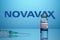 Novavax Logo with Inoculation Syringe and Covid Vaccine