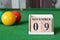 November 09, number cube with balls on snooker table, sport background.