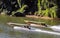 November 2018 - Kanchanaburi, Thailand - two long tail boats navigate the river Kwai.