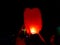 November 2018, Kolkata, India. Two person releasing lighted paper hot air balloon in sky lantern festival at night at Kolkata,