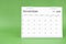 November 2024 desk calendar isolated in green.