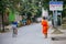 NOVEMBER 27, 2016 MAE SOT, THAILAND - monk with orange robe walking in the street in mae sot Thailand