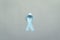 November light blue ribbon on gray background with copy space, Prostate cancer awareness month, men`s health concept