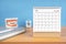 The November monthly desk calendar for 2023 year and model dentures on the table. Dental health concepts