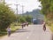 November21, 2018. Laos school children and village people traveling to work and school, sharing narrow road street between LU