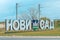 Novi Sad LED light city sign with town name in cyrillic alphabet at entrance