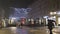 Novi Sad, Serbia. January - 15. 2024. Night view of city life on the cold snowy winter day with buildings and people walking under