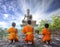 Novice Monk praying to the Buddha in Phrabuddhachay Temple