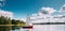 Novoe Lyadno, Beloozerny District, Vitebsk Region, Belarus. Man Sailing On Motorboat Or Powerboat With White Sails On