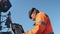 Novosibirsk region, August 3, 2020. A worker works with a paver paver control panel at sunset. Men at work. Road