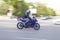 Novosibirsk/ Russia - 25.05.2019: Moto racer rides fast in city traffic on blurred background